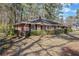 Classic brick home with manicured hedges and a well-kept lawn, offering a traditional aesthetic at 1672 Zemory Dr, Tucker, GA 30084