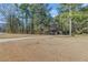 Expansive front yard with a long driveway leading to a well-maintained, brick home at 1672 Zemory Dr, Tucker, GA 30084