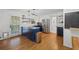 Well-designed kitchen with stainless steel appliances, navy blue cabinets, and a center island with cooktop at 1672 Zemory Dr, Tucker, GA 30084