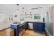 Bright kitchen with white and navy cabinets, stainless steel appliances, and hardwood floors at 1672 Zemory Dr, Tucker, GA 30084