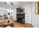 Inviting living room with fireplace and a large television, complete with hardwood floors at 1672 Zemory Dr, Tucker, GA 30084