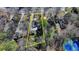 Aerial view of the property showcasing its location on a tree-lined street and relationship to nearby homes at 1926 N Decatur Ne Rd, Atlanta, GA 30307
