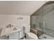 Bathroom featuring toilet, sink and seamless glass shower enclosure at 1926 N Decatur Ne Rd, Atlanta, GA 30307