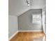 Close up of the brick accent wall bedroom with hardwood floors at 1926 N Decatur Ne Rd, Atlanta, GA 30307