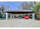 Carport with two parked cars and a lawn and light-blue shed to the left at 1926 N Decatur Ne Rd, Atlanta, GA 30307