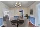 Elegant dining room showcasing hardwood floors, wainscoting, and a vintage chandelier at 1926 N Decatur Ne Rd, Atlanta, GA 30307