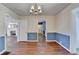 Open dining room with hardwood floors, wainscoting, and a view into the living spaces at 1926 N Decatur Ne Rd, Atlanta, GA 30307