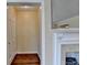 Bright entryway featuring hardwood floors, a closet, and a view of a fireplace, creating a welcoming atmosphere at 1926 N Decatur Ne Rd, Atlanta, GA 30307