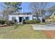 Charming blue single-story home featuring a manicured front yard and classic architectural details at 1926 N Decatur Ne Rd, Atlanta, GA 30307