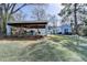 Beautiful single-Gathering home with light blue siding, a covered carport, and well-manicured front lawn at 1926 N Decatur Ne Rd, Atlanta, GA 30307
