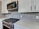 Close up of the oven range in the kitchen with quartz countertops at 1926 N Decatur Ne Rd, Atlanta, GA 30307