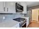 Close up of the kitchen with stainless steel oven range and quartz countertops at 1926 N Decatur Ne Rd, Atlanta, GA 30307