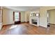 Cozy living room featuring hardwood floors, a fireplace, and a window with natural light at 1926 N Decatur Ne Rd, Atlanta, GA 30307