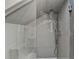 Modern bathroom shower featuring gray subway tiles and a built-in bench, with a clear glass partition at 1926 N Decatur Ne Rd, Atlanta, GA 30307