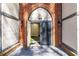 The building's main entrance features brick accents and a grand archway at 6851 Roswell Rd # L1, Atlanta, GA 30328
