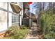 Exterior side view of building with sidewalk and vegetation at 6851 Roswell Rd # L1, Atlanta, GA 30328