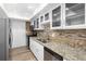 Modern kitchen featuring granite countertops, white cabinets and stainless steel appliances at 6851 Roswell Rd # L1, Atlanta, GA 30328