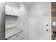 Clean and bright kitchen, featuring granite countertops and white cabinets at 6851 Roswell Rd # L1, Atlanta, GA 30328