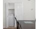 This dining room area includes closet with doors opened to reveal a laundry machine at 6851 Roswell Rd # L1, Atlanta, GA 30328