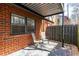 Enjoy this cozy brick patio with seating for two, perfect for relaxing outdoors at 6851 Roswell Rd # L1, Atlanta, GA 30328