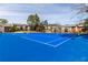 View of a tennis court, featuring buildings in the background, showcasing community amenities at 6851 Roswell Rd # L1, Atlanta, GA 30328