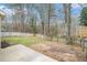 A spacious backyard with a patio and lush green grass at 725 Victoria Station Blvd, Lawrenceville, GA 30043