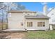 This backyard features a well-manicured lawn, a patio, and a wood fence at 725 Victoria Station Blvd, Lawrenceville, GA 30043