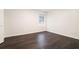 Small bedroom featuring hardwood floors, one window and base trim throughout at 725 Victoria Station Blvd, Lawrenceville, GA 30043