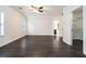 Spacious primary bedroom with a ceiling fan, large closet and access to the bathroom at 725 Victoria Station Blvd, Lawrenceville, GA 30043