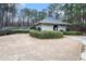 This community building is surrounded by mature trees and lush landscaping at 725 Victoria Station Blvd, Lawrenceville, GA 30043