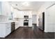 Updated kitchen featuring stainless steel appliances, white cabinets, hardwood floors, and modern finishes at 725 Victoria Station Blvd, Lawrenceville, GA 30043