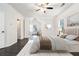 Cozy main bedroom with hardwood floors, a large window and stylish decor at 725 Victoria Station Blvd, Lawrenceville, GA 30043