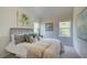 Cozy bedroom with large windows, soft carpeting, and charming decorative wall art at 746 River Gardens Dr Se # 746 River Gardens Dr Se, Atlanta, GA 30354