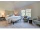Spacious main bedroom with seating area, plush carpet, and large window with backyard views at 746 River Gardens Dr Se # 746 River Gardens Dr Se, Atlanta, GA 30354