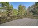 View of a new wood deck overlooking a green space surrounded by woods at 746 River Gardens Dr Se # 746 River Gardens Dr Se, Atlanta, GA 30354
