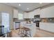 This kitchen is modern and features an island, white cabinets and stainless steel appliances at 746 River Gardens Dr Se # 746 River Gardens Dr Se, Atlanta, GA 30354
