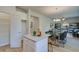 Charming kitchen island with white cabinets, granite countertops, and open access to dining area at 746 River Gardens Dr Se # 746 River Gardens Dr Se, Atlanta, GA 30354