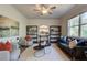 Bright living room features modern ceiling fan, neutral furniture, and decorative shelving at 746 River Gardens Dr Se # 746 River Gardens Dr Se, Atlanta, GA 30354