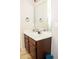 Bathroom featuring a wood vanity, white countertop, and a large mirror at 15 Blanket Pass, Covington, GA 30016