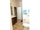 Bathroom featuring a wood vanity, tiled floors and a toilet at 15 Blanket Pass, Covington, GA 30016