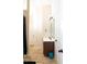 Bathroom with a wood vanity, tiled floors, modern lighting, and open layout at 15 Blanket Pass, Covington, GA 30016