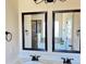 Bathroom vanity featuring double mirrors, white countertop, and dark hardware fixtures at 15 Blanket Pass, Covington, GA 30016