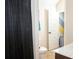 Bathroom showing a shower with a black curtain, toilet, and wood vanity at 15 Blanket Pass, Covington, GA 30016