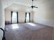 Spacious bonus room with carpet, wainscoting and plenty of natural light from large windows at 15 Blanket Pass, Covington, GA 30016