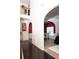 Bright foyer with archways leading to dining, hardwood floors, and views of the upper level at 15 Blanket Pass, Covington, GA 30016