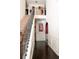 Inviting foyer with dark hardwood floors, staircase, and wainscoting detail at 15 Blanket Pass, Covington, GA 30016