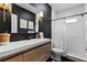 Bathroom showcasing modern black and white design elements and a walk-in shower at 2571 Weddington Ne Rdg, Marietta, GA 30068