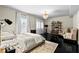 Spacious bedroom features a chandelier, sitting area, and views from the window at 2571 Weddington Ne Rdg, Marietta, GA 30068