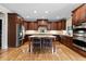 Beautiful kitchen with dark wood cabinets, granite countertops and stainless-steel appliances at 2571 Weddington Ne Rdg, Marietta, GA 30068
