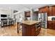 Spacious eat-in kitchen boasts stainless appliances, granite countertops, and hardwood flooring at 2571 Weddington Ne Rdg, Marietta, GA 30068